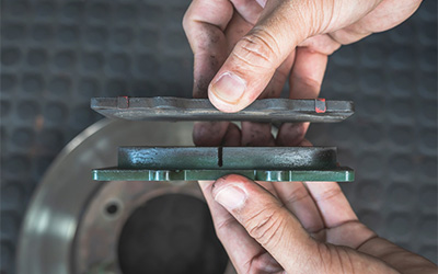 Examine brake pads